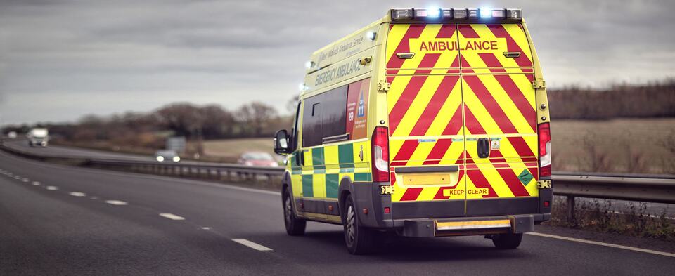 An ambulance travelling along a motorway